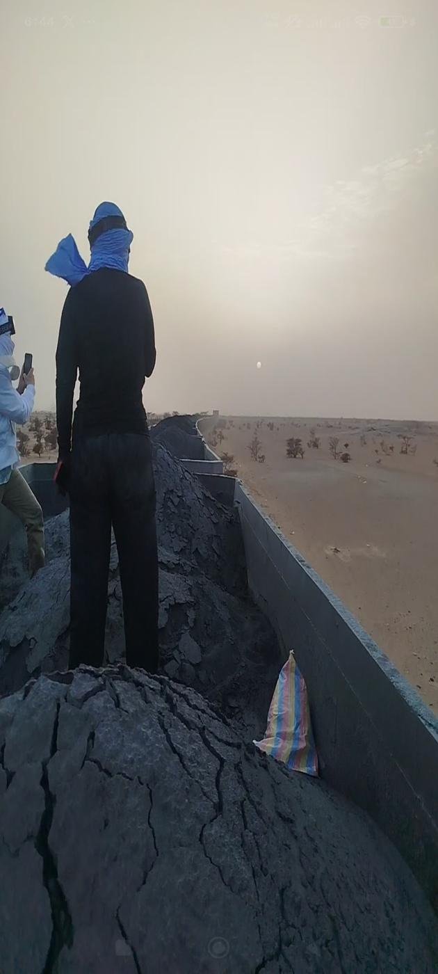 Ore wagons of the Mauritanian desert train waiting in the Sahara near Choum